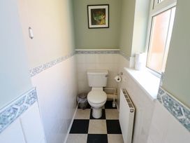 A bathroom with a toilet and sink at Maples in Hunstanton