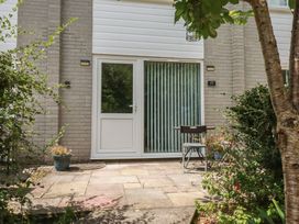 An outdoor entrance with a door and seating area at 49 Atlantic Reach Newquay