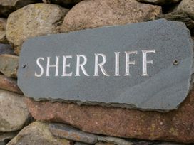 A sign on a stone wall at Sherriff in Troutbeck, near Keswick