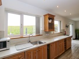 A kitchen with counter space and windows at Sherriff, Troutbeck, near Keswick