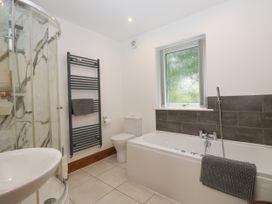 A bathroom with a shower and bathtub at Sherriff in Troutbeck, near Keswick