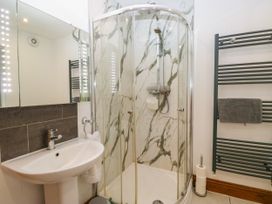 A bathroom with a shower and sink at Sherriff, Troutbeck, near Keswick