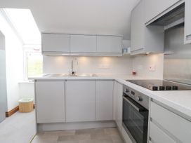 A kitchen with cabinets, sink, and appliances at Sherriff, Troutbeck, near Keswick