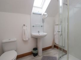 A bathroom with a sink, shower and toilet at Sherriff, Troutbeck, near Keswick
