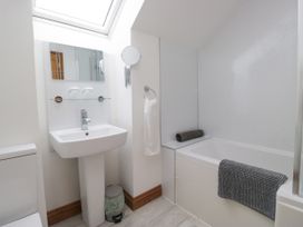 A bathroom with sink and bathtub at Sherriff, Troutbeck, near Keswick