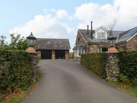 A house with a garage and driveway at Sherriff, Troutbeck, near Keswick