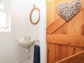 A bathroom with a sink and mirror at Afallon in Llanbedrog
