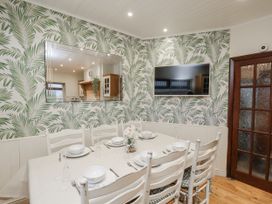 A dining room with a table and chairs at Beachcrest in Whitby