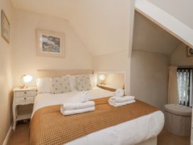 A bedroom with a bed and bedside table at Beachcrest in Whitby
