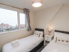 A bedroom with two single beds at Beachcrest in Whitby