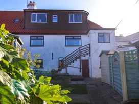 A house with a garden and stairs at Beachcrest in Whitby