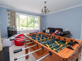 A snug with a foosball table and sofa at Raincliffe Manor in Scarborough