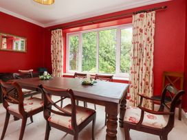 A dining room with a table and chairs at Raincliffe Manor in Scarborough