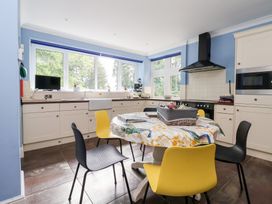 A kitchen with a table and chairs at Raincliffe Manor in Scarborough