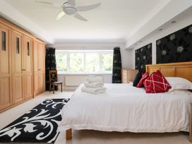 A bedroom with a bed and wardrobe at Raincliffe Manor in Scarborough