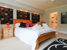 A bedroom with a bed and towels on it at Raincliffe Manor in Scarborough