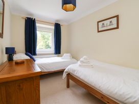 A bedroom with two beds and a dresser at Raincliffe Manor in Scarborough