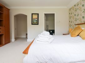 A bedroom with towels on a bed at Raincliffe Manor in Scarborough