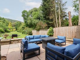 A garden with seating and a barbecue at Raincliffe Manor Scarborough