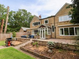 A house with patio and garden features at Raincliffe Manor in Scarborough