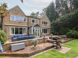 A house with patio seating and grill at Raincliffe Manor in Scarborough