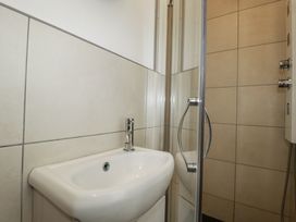 A bathroom with a sink and shower at The Three Tees in Newquay