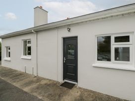 An exterior view of a house featuring a front door and windows at Churchfield House Moygownagh near Crossmolina, County Mayo