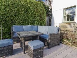 A seating area with a sofa and table at Tresawle in Crantock