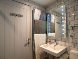 A bathroom with a sink and towels hung at Garden View Apartment in Kingsbridge