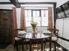 A dining room with a table and chairs at Avonmede in Tewkesbury