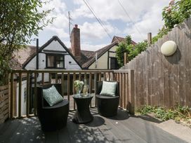 An outdoor seating area with two chairs and a table at Avonmede in Tewkesbury