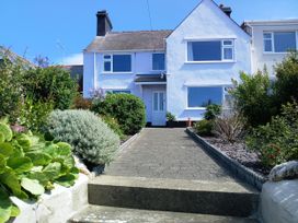A house with a garden and pathway at Old School House in Cemaes Bay