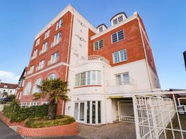 A building with multiple windows and balconies at Sail Away, 17 Union Mill, Whitby
