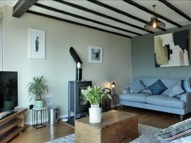 A living room with a sofa and coffee table at Ocean View in Downderry