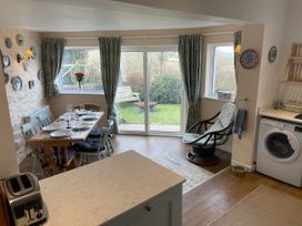 A dining room with a table and chairs at Penllain, Newport, Pembrokeshire