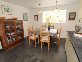 A dining room with a table and chairs at One Town End, Mungrisdale, Mosedale
