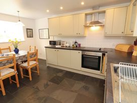 A kitchen with a table and chairs at One Town End in Mungrisdale, Mosedale
