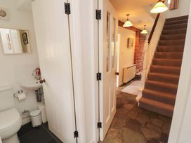 A hallway with a toilet and sink at One Town End in Mungrisdale, Mosedale