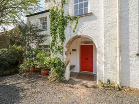 An entrance with a red door and plants at Red Screes in Ambleside
