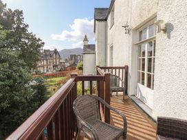 A balcony with chairs and a view at Red Screes in Ambleside