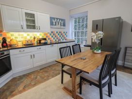 A kitchen with a table and chairs at Red Screes in Ambleside