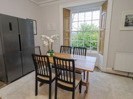 A dining room with a table and chairs at Red Screes in Ambleside