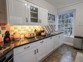 A kitchen with appliances and cabinets at Red Screes in Ambleside