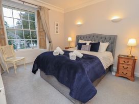 A bedroom with a bed and window at Red Screes in Ambleside