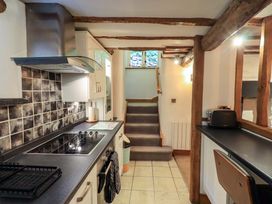 A kitchen with a stove and countertop at Fellside Cottage Bowness-On-Windermere