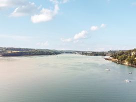 A view of a river with boats on the water at Afallon in Menai Bridge