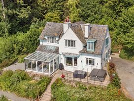 A house with a conservatory and garden at Afallon in Menai Bridge