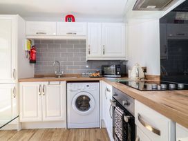 A kitchen with modern appliances and fixtures at 13 Manorcombe Bungalows near Gunnislake