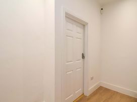 A hallway with a door at Beachwalk Villa 1