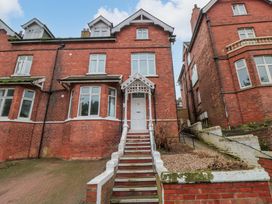 A house with a front entrance and stairs at Beachwalk Villa 1 in Whitby